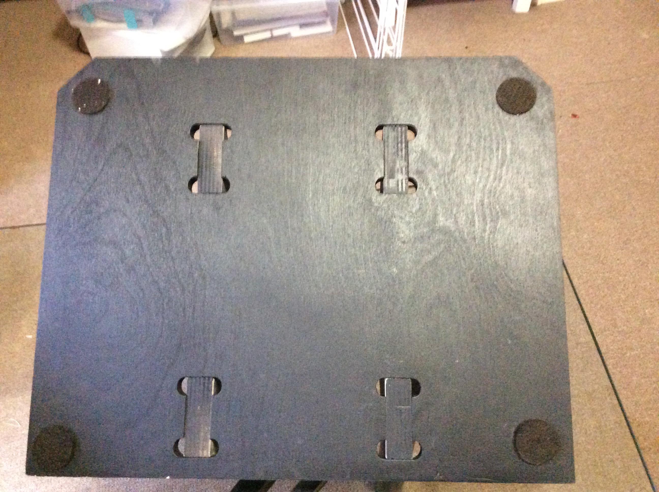 A cradle wing with pads to protect the platen.